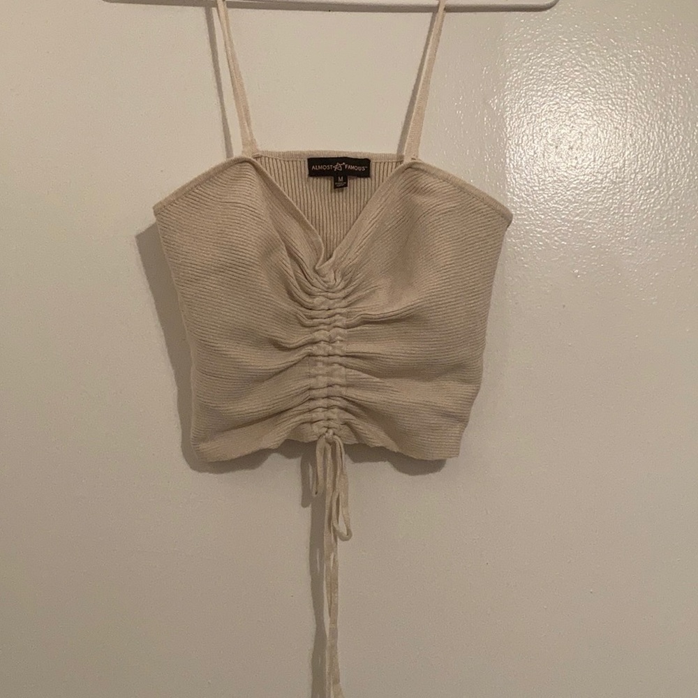 Tan crop with tie
